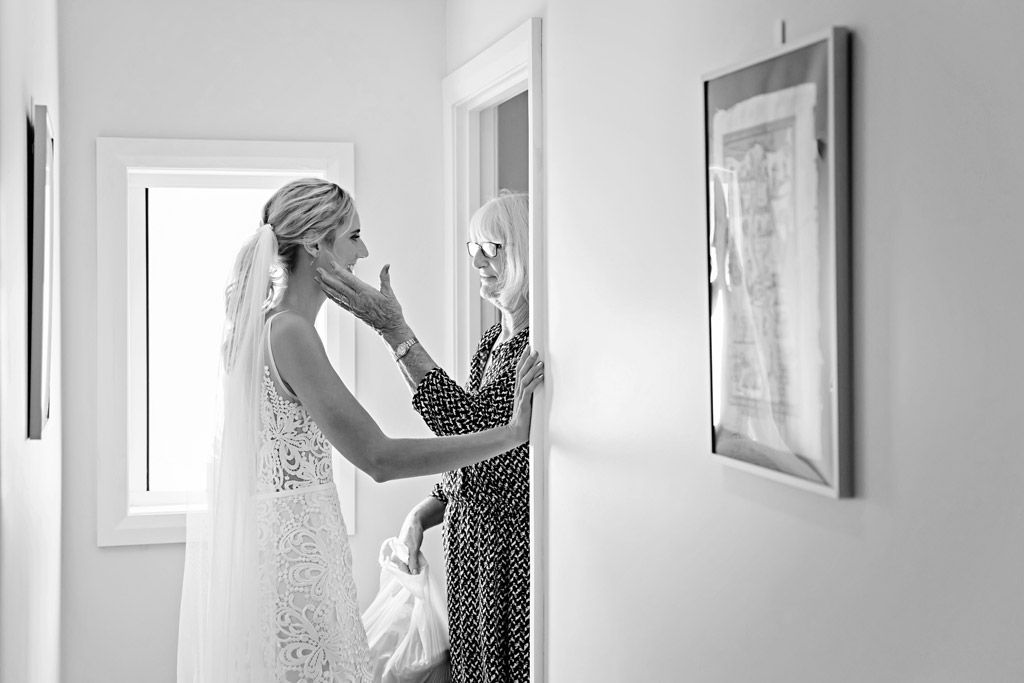 mother and daughter moment getting married caves beach candid photographer