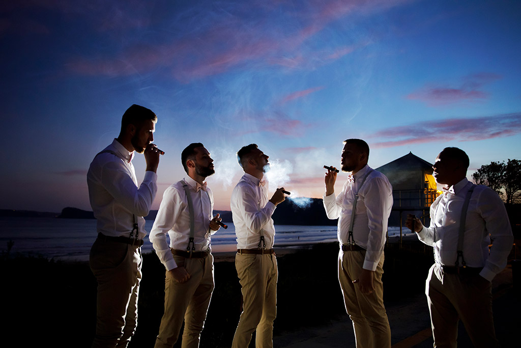 ocean beach wedding photographer groomens and cigars