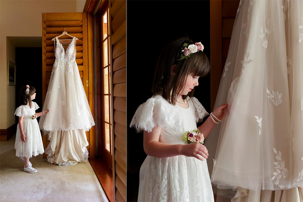 daughter looking at mums wedding dress