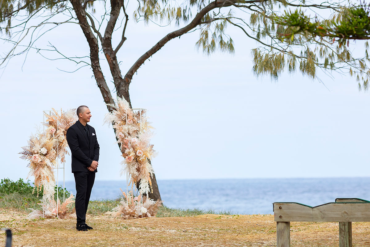 groom waiting for bride caves beach wedding