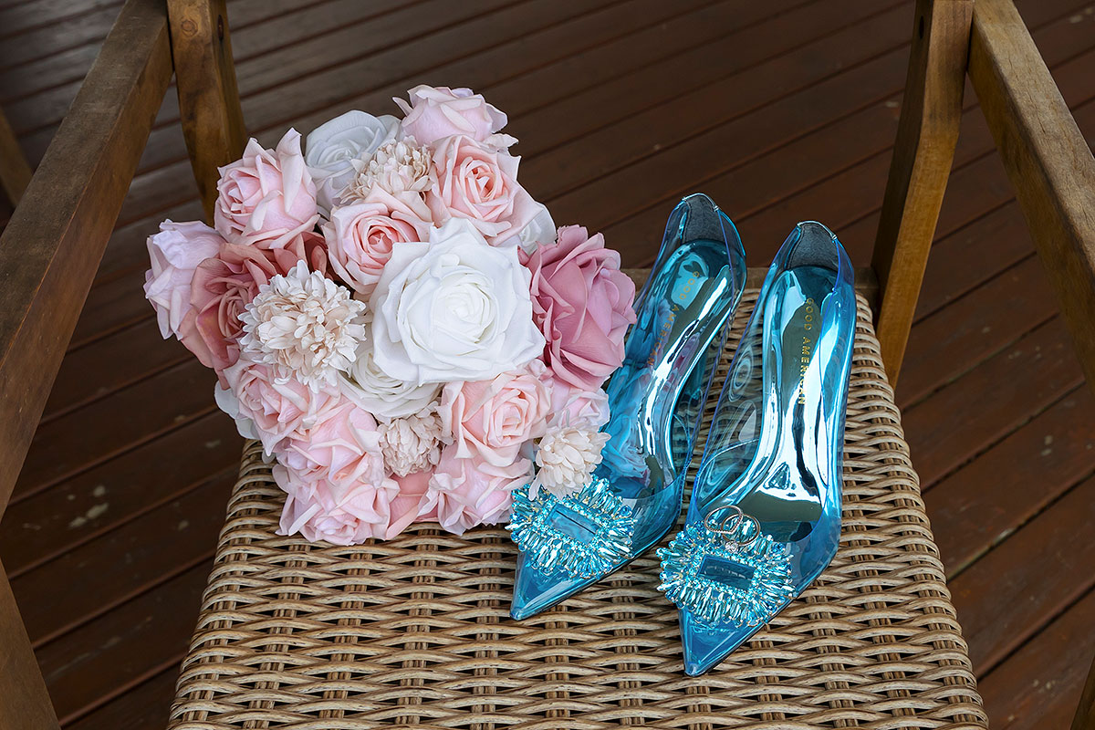 blue wedding shoes and pink flowers