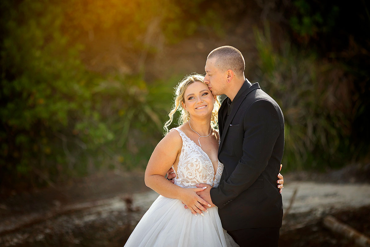 caves beach wedding photos bride and groom